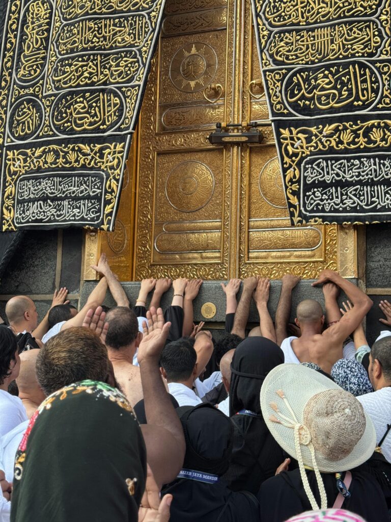 Faithful pilgrims gathered in prayer at the sacred Kaaba in Mecca, capturing a moment of devotion.